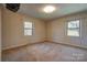 Charming bedroom with two windows and patterned wallpaper at 608 Hanover Dr, Shelby, NC 28150