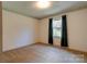 Well-lit bedroom with window and dark curtains at 608 Hanover Dr, Shelby, NC 28150