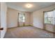 Bright bedroom with neutral walls and carpeting at 608 Hanover Dr, Shelby, NC 28150