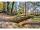 Charming creekside property with a rustic wooden bridge at 608 Hanover Dr, Shelby, NC 28150