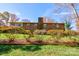 Back exterior of brick house with landscaping at 608 Hanover Dr, Shelby, NC 28150