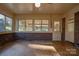 Sunroom features brick walls, tiled floors, and multiple windows at 608 Hanover Dr, Shelby, NC 28150