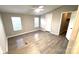 Spacious bedroom with ceiling fan and luxury vinyl flooring at 6706 Wolf Pond Rd, Monroe, NC 28112