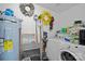 Laundry room with washer, dryer, and storage shelves at 8093 Regent Park Ln, Charlotte, NC 28210