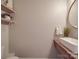 Simple bathroom with floating vanity and a large oval mirror at 843 Hathcock Glen Dr, Oakboro, NC 28129