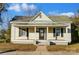 Charming yellow cottage with front porch and landscaping at 110 E 5Th Ave, Gastonia, NC 28052