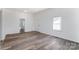 Spacious living area with hardwood floors and neutral walls at 110 E 5Th Ave, Gastonia, NC 28052