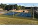 Community basketball courts, playground, and grassy area at 151 Dogwood Cir, New London, NC 28127