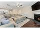 Spacious living room featuring a large sectional sofa and a fireplace at 1804 Sutter Creek Dr, Waxhaw, NC 28173