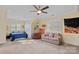 Spacious bedroom with a queen bed and a comfy couch at 18912 Peninsula Point Dr, Cornelius, NC 28031