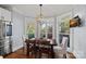Bright breakfast nook with bay window, wooden table, and four chairs at 18912 Peninsula Point Dr, Cornelius, NC 28031