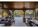 Relaxing covered patio with outdoor seating, overlooking the pool at 18912 Peninsula Point Dr, Cornelius, NC 28031