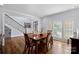 Bright dining room with hardwood floors and large windows at 18912 Peninsula Point Dr, Cornelius, NC 28031