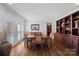 Elegant dining room with built-in cabinetry and hardwood floors at 18912 Peninsula Point Dr, Cornelius, NC 28031