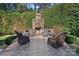 Relaxing stone fireplace and patio area perfect for outdoor gatherings at 18912 Peninsula Point Dr, Cornelius, NC 28031