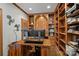 Spacious home office with built-in shelves and a large desk at 18912 Peninsula Point Dr, Cornelius, NC 28031