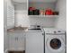 Laundry room with washer, dryer, and ample storage shelving at 18912 Peninsula Point Dr, Cornelius, NC 28031