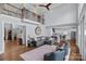 Spacious living room with hardwood floors, high ceilings, and a view of the kitchen at 18912 Peninsula Point Dr, Cornelius, NC 28031