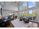 Open living room with large windows and access to outdoor deck at 18912 Peninsula Point Dr, Cornelius, NC 28031