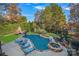 Inviting kidney-shaped pool with a spa and lounge chairs at 18912 Peninsula Point Dr, Cornelius, NC 28031