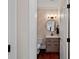Stylish powder room with a modern vanity and chevron wallpaper at 18912 Peninsula Point Dr, Cornelius, NC 28031