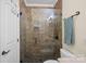 Large shower with neutral tile and glass enclosure at 18912 Peninsula Point Dr, Cornelius, NC 28031