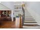Stunning staircase with wrought iron railings and hardwood steps at 18912 Peninsula Point Dr, Cornelius, NC 28031