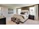 Main bedroom with white upholstered bed, dark brown accents, and carpet flooring at 2220 Millennium Dr # 86, Lancaster, SC 29720