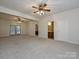 Finished basement with 2 ceiling fans, carpet, and access to bathroom at 25040 Timberlake Dr, Tega Cay, SC 29708