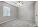 Bright bedroom with ceiling fan, carpet, and neutral walls at 2507 Lawton Bluff Rd, Charlotte, NC 28226