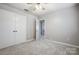 Spacious bedroom with double doors leading to the hallway at 2507 Lawton Bluff Rd, Charlotte, NC 28226