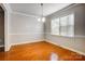 Bright dining room with hardwood floors and neutral wall colors at 2507 Lawton Bluff Rd, Charlotte, NC 28226