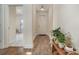 Light-filled entryway with hardwood floors and view of a game room at 3116 Village Glen Ln, Charlotte, NC 28269