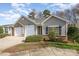 Two-unit building with gray siding and double garage at 3116 Village Glen Ln, Charlotte, NC 28269