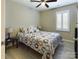 Bright bedroom with queen bed, ceiling fan, and plantation shutters at 3215 24Th Ne St, Hickory, NC 28601