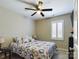 Spacious bedroom with a queen bed, ceiling fan, and plantation shutters at 3215 24Th Ne St, Hickory, NC 28601