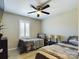 Bedroom with two twin beds, ceiling fan, and plantation shutters at 3215 24Th Ne St, Hickory, NC 28601