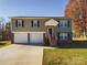 Two-story house with a two-car garage and a landscaped yard at 3215 24Th Ne St, Hickory, NC 28601