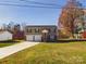Modern house with a two-car garage and a spacious yard at 3215 24Th Ne St, Hickory, NC 28601