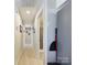 Long hallway with light walls and wood-look flooring, leading to bedrooms and bathroom at 3215 24Th Ne St, Hickory, NC 28601