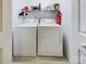 Bright laundry room with washer and dryer, and shelving for storage at 3215 24Th Ne St, Hickory, NC 28601