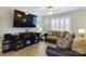 Living room features a large TV, comfortable seating, and wood-look flooring at 3215 24Th Ne St, Hickory, NC 28601