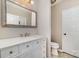 Main bathroom with white vanity, marble countertop, and toilet at 3220 Selwyn Farms Ln # 4, Charlotte, NC 28209