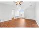 Spacious bedroom with hardwood floors and a large window at 3519 Crescent Knoll Dr, Matthews, NC 28105