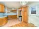 Kitchen with wood cabinets, laminate floors and a window at 3524 Wolfe Rd, Monroe, NC 28110