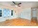 Hardwood floor living room with a ceiling fan and lots of natural light at 3524 Wolfe Rd, Monroe, NC 28110