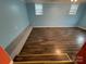 Unfinished basement with light blue walls and hardwood floors at 3630 Old Mocksville Rd, Salisbury, NC 28144