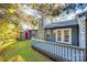 Back exterior view showing deck and stone chimney at 434 English Ivy Ct, Fort Mill, SC 29715