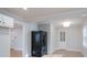 Bright kitchen features white cabinets and black appliances at 4426 Holbrook Dr, Charlotte, NC 28205