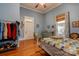 Well-lit bedroom featuring hardwood floors and ample closet space at 600 W Warren St, Shelby, NC 28150